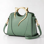 Bellatrix Women's Feline Top-Handle Crossbody Handbag - Green - Accessories > Handbags > Crossbody Handbags - Eric Muller - Image 1